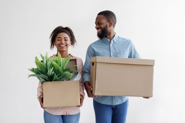 glad-young-black-husband-and-wife-hold-cardboard-b-2021-10-11-23-24-26-utc (1)